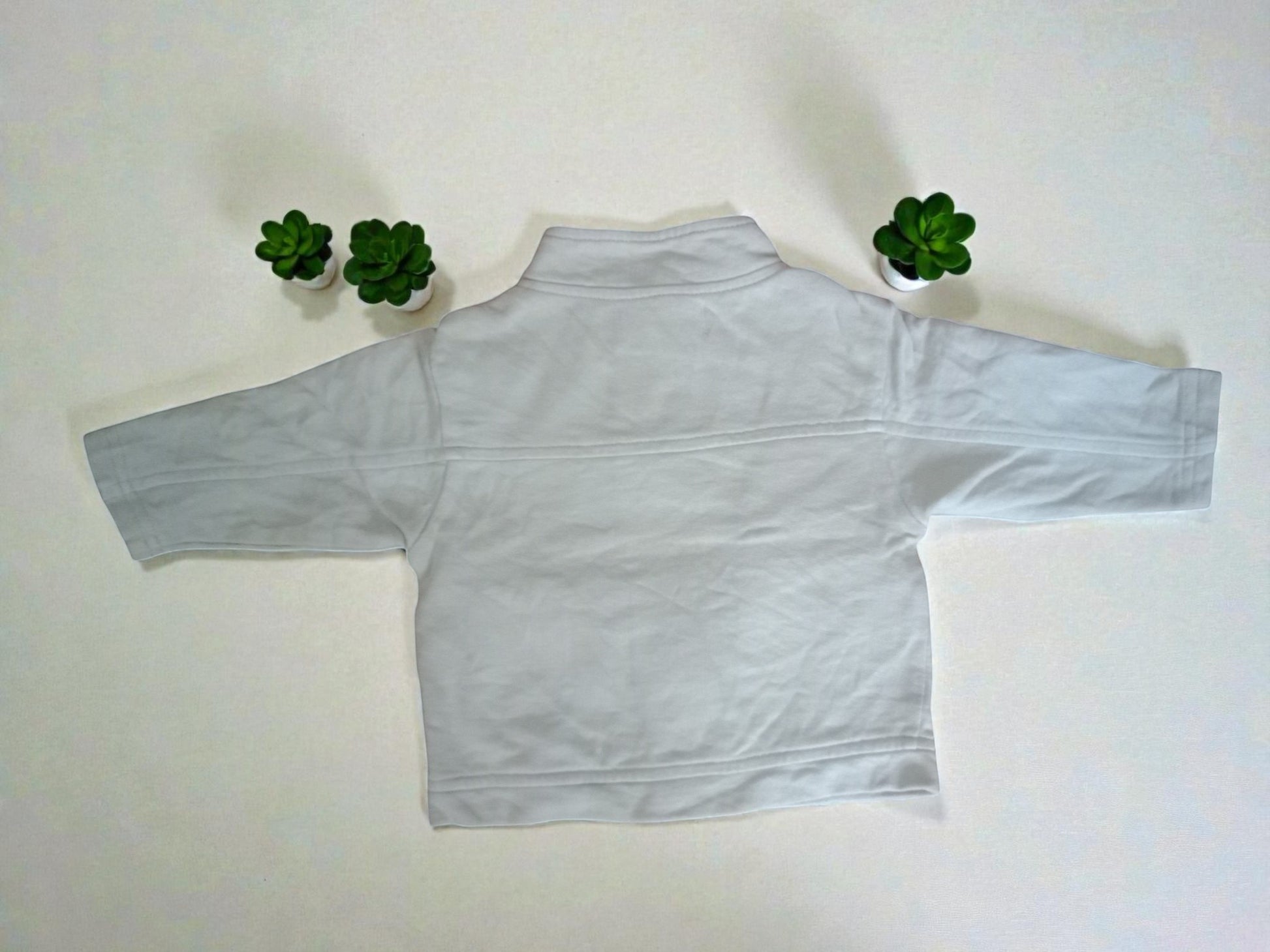 Jeans And Jackets light grey zip-neck fleece sweatshirt with long sleeves and a stand-up collar.